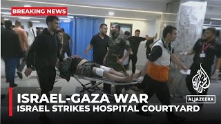 Israeli air strikes hit al-Ahli al-Arabi hospital in Gaza where hundreds of people were sheltering