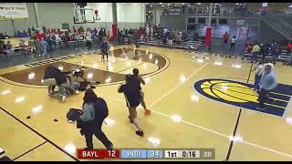 Fight between referee and team at youth basketball game . Ref gets suplexed.