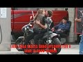 Lady Gaga steals a kiss from co-star Bradley Cooper on the set of A Star Is Born