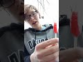 trying a strawberry lollipop rating food candy