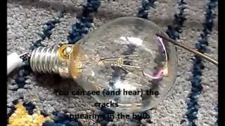 Cracking a broken light bulb and burning the tungsten wire with high voltage