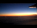 Jet contrail over the horizon at sunrise over the Pacific
