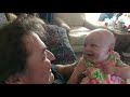 baby aubrietta getting kisses and smiling with her grandpa