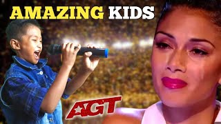 GOLDEN BUZZER: This little boy made the jury cry Sing a song heart alone America