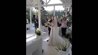 Father stops midway down the aisle to ask his daughter's Step Father to join them