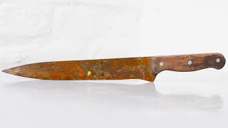 Restoration old rusty  knife. Remove rust from the knife