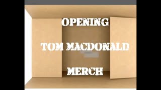 Open Box of Tom MacDonald’s new shirts and CD