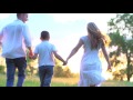 happy family running through field