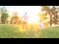 happy family running through field