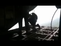 jumpmaster gets sucked out of a plane when his parachute deploys early