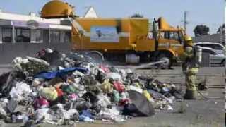 Rubbish truck dumps burning load