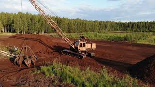 Excavator on the peatbog in Balozi