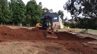 Mecalac MCR skid steer excavator along a bank