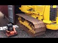 komatsu d31 bulldozer being containerized by big iron inc.mov