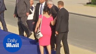 Jean-Claude Juncker stumbles and is helped by leaders at NATO gala