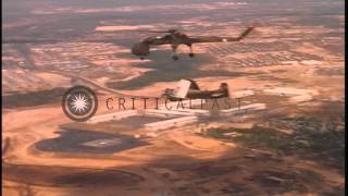 A US Army CH-54 Tarhe helicopter delivers a wrecked VNAF A-1E Skyraider bomber at...HD Stock Footage