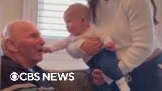 Great-grandpa with Alzheimer's lights up when meeting great-grandchild