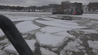 U.S. Coast Guards break the ice on the Penobscot River and have fun doing it