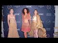 Models Keeyln, Ashley, and Marlee POSE wearing Atelier Del Sol at Artheartsfashion NYFW