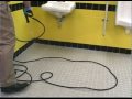 cleaning a restroom floor with a kaivac no touch cleaning system