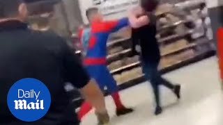 Shocking moment 'Spiderman' kicks and punches a store employee as onlookers watch in horror