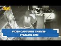 Surveillance video captures thieves ramming stolen truck into store, ripping away ATM