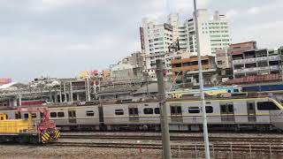 111/2/1日554次莒光號和123次PP自強號通過嘉義後站機車停車場(由老蕭親自拍攝)