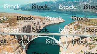 Aerial view of Maslenica Bridge in Croatia going across the sea canal