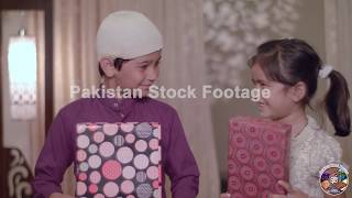 Muslim Children smiling, happy to receive Gifts from Parents on Eid Holidays