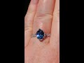 2.5 carat precision cut blue spinel in white gold lotus diamond engagement ring with milgrain bezels