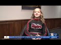 taylor county middle school cheerleader helps man stand for national anthem