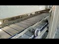 Pan conveyor details. Apron conveyor. Metal conveying equipment in cement industry. Factory support