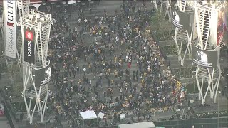Staples Center: Thousands of Kobe Bryant fans building memorials of candles, flowers and holding Lak