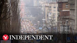 Long lines of traffic form near Kiev station after Russia launches attack on Ukraine