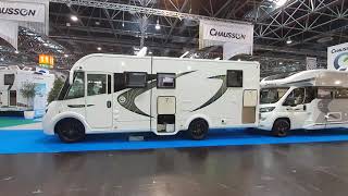 Overweight integrated Chausson motorhome with a queen bed.