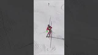 World cup skier smashing a slalom course in the steepest slope in Saas Fee.