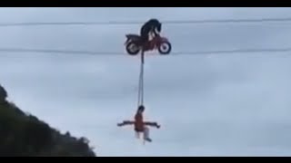 A Bear riding a bike on a tight rope バイクを運転するクマ-China