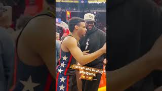 LeBron James and his son, Bronny, dap it up following the McDonald's All-American Game