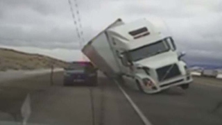 Caught on camera: Truck blows over in wind storm