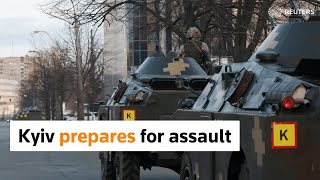 Under missile fire, Kyiv awaits Russian assault