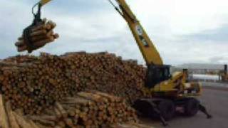 caterpillar 325d  stacking logs