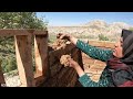 Building a very beautiful mud hut in the mountains by a village woman