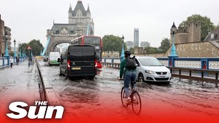 Tower Bridge flooded \u0026 Tube stations underwater as torrential rain hits London in severe UK weather