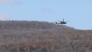 Helicopters pick up water from Greenwood Lake to battle forest fires