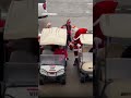 Taylor Swift rides in a golf cart with Santa at Chiefs game