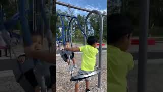 Cute Kids Swinging Together