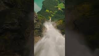 Waterfall drone dive on a mountain scene