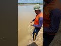 a cast net fishing traditional trap in the village shorts