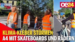Klima-Kleber stürmen A4 mit Skateboards und Rädern