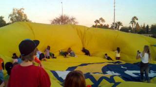 Kids helping deflate the baloon